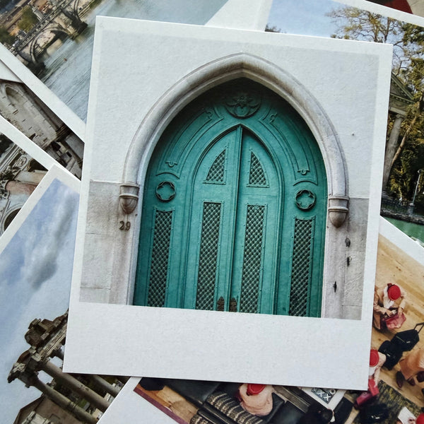Collection of postcards with architectural images, including a green door.