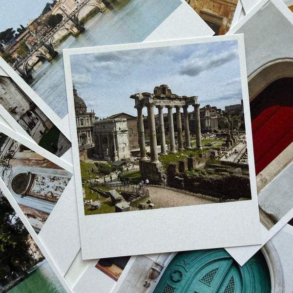 Stack of vintage-style photographs featuring historical architecture.