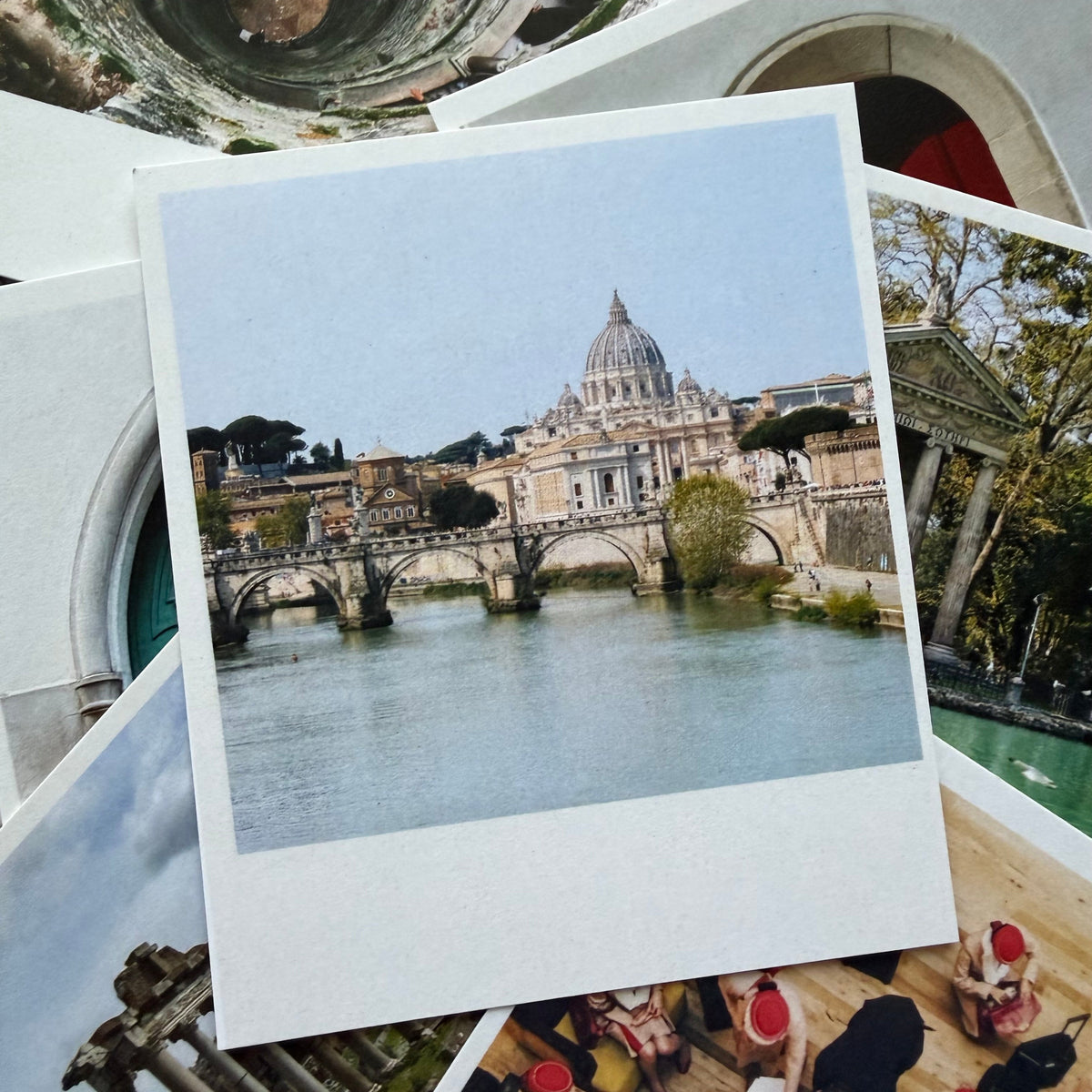 Stack of postcards with images of a cathedral and people.