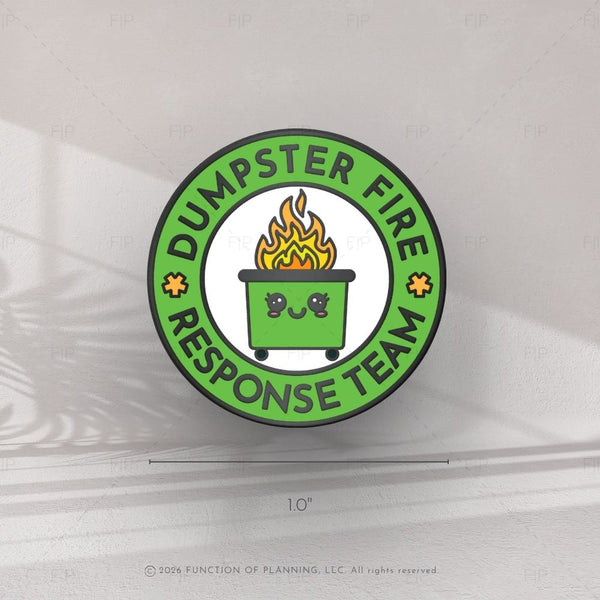 Circular sticker with 'Dumpster Fire Response Team' text and a cartoon trash bin with flames on a white background.